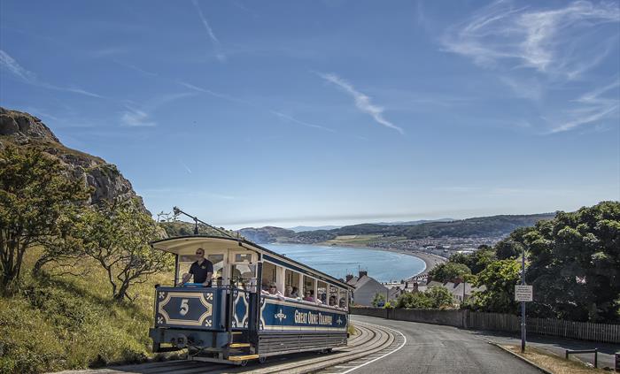 Great Orme Tramcar climbing up with view of Llandudno